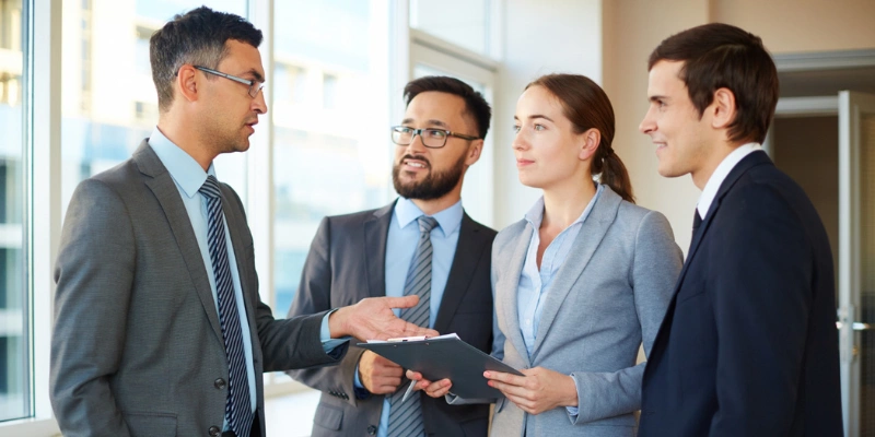 Real estate professionals discussing referral opportunities